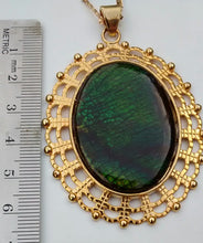 Load image into Gallery viewer, Oval Shaped Green Colored Ammolite in a Gold Colored Setting Necklace
