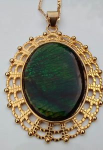 Oval Shaped Green Colored Ammolite in a Gold Colored Setting Necklace