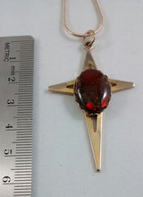 Load image into Gallery viewer, Gold colored cross necklace decorated with ammolite
